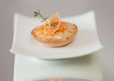 A appetizer with caramelized goat cheese from MI CORAZON Catering